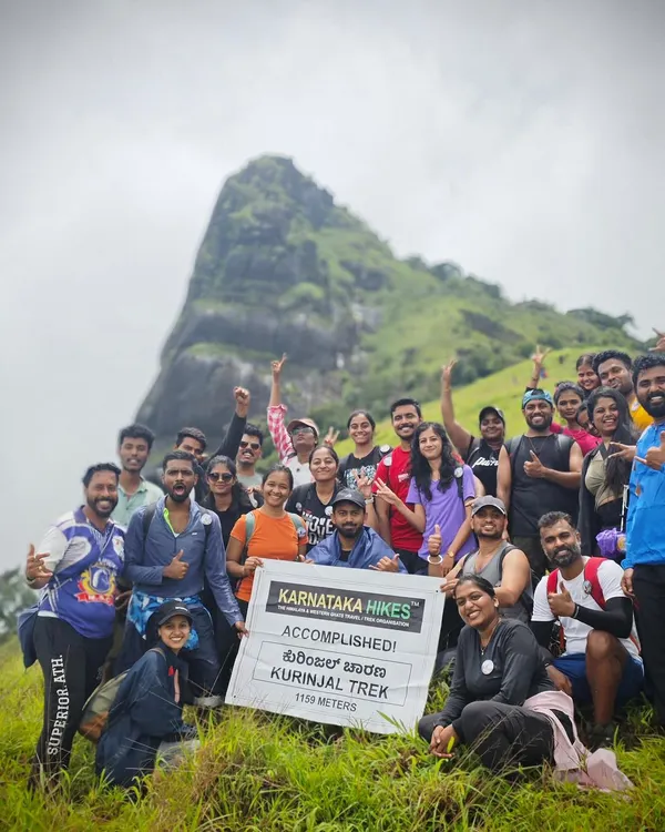 Our group at the summit of Kurinjal Trek, holding our banner high. Another peak conquered!