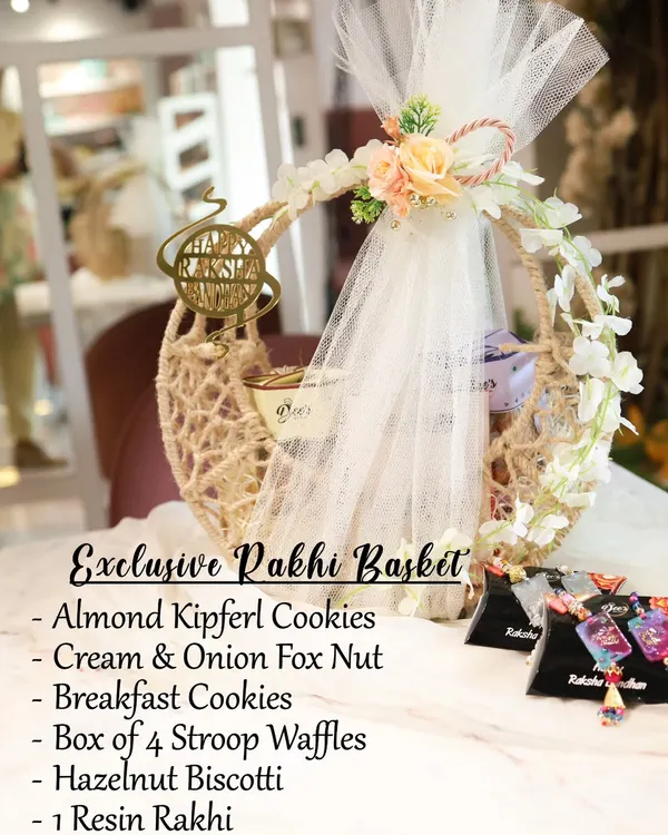 My most luxurious Rakhi offering, the Exclusive Rakhi Basket. This crescent-shaped jute basket is packed with Almond Kipferl Cookies, Cream & Onion Fox Nuts, Stroop Waffles, Hazelnut Biscotti, and a beautiful Resin Rakhi.
