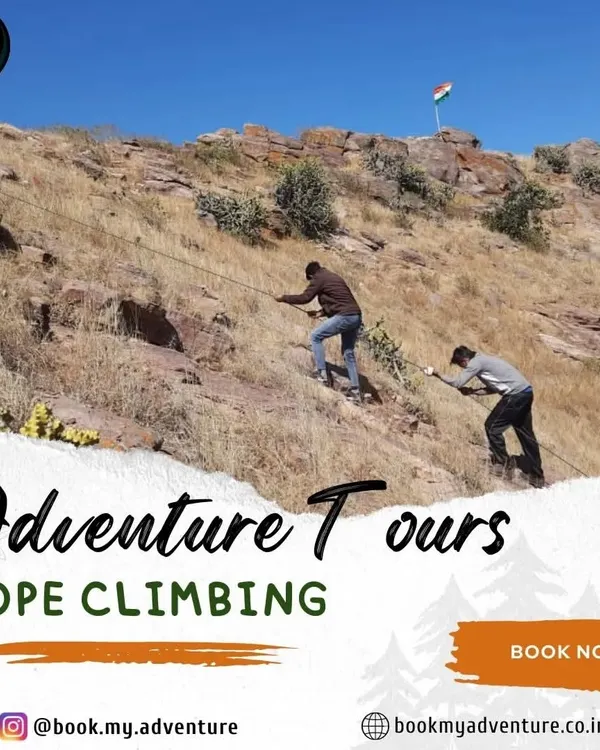 Two adventurers practice rope climbing on a rocky incline. This activity is a great test of strength and endurance, and we provide all the safety equipment and guidance needed to help you reach the top.