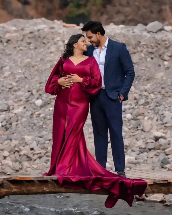 This wine-red fishtail gown is one of my most requested pieces for pre-wedding shoots. The dramatic train and satin fabric create a stunning silhouette against any backdrop.
