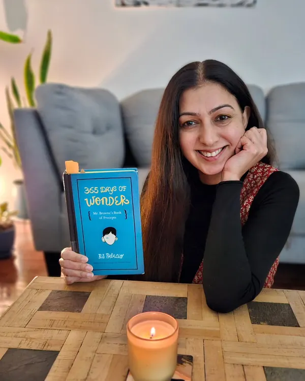 I believe in the power of daily reflection. Here I am with the book '365 Days of Wonder', which inspired my '48 Weeks of Wonder' online series. It's a simple, powerful practice for adults to connect with themselves through writing.