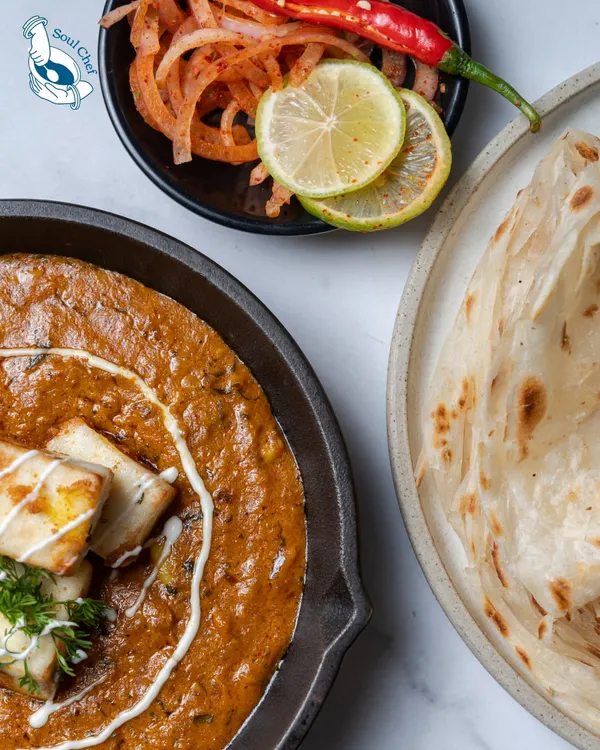 The rich, creamy goodness of our special Paneer gravy, served alongside flaky Laccha Parathas. This is a classic North Indian combination that we've perfected for our catering menus.