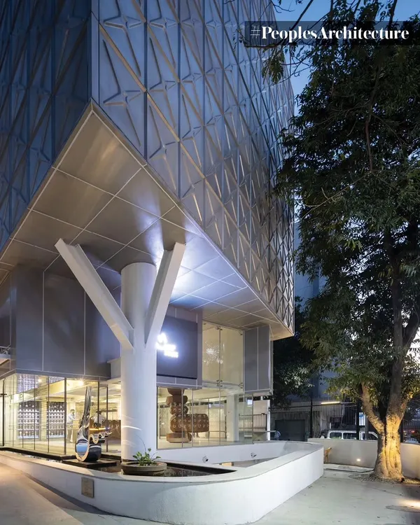 The Museum of Art & Photography (MAP) in Bangalore, featuring a tree-like column that supports the structure. This element is a nod to the Garden City, grounding the modern building in its local identity and creating a welcoming gesture at the entrance.