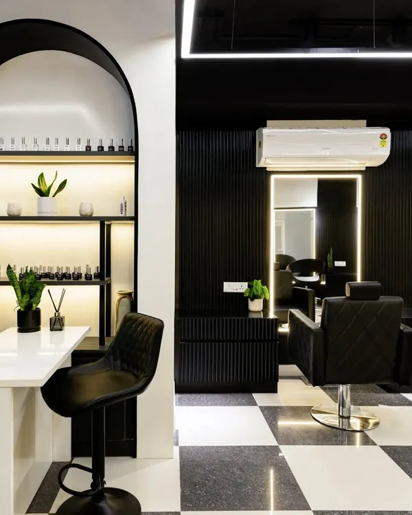 In a salon, elegance must meet function. This manicure station features a striking arch backdrop to display nail colors, creating a playful yet sophisticated focal point. The design balances symmetry and clean lines for a calm, captivating oasis.
