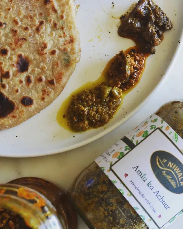 This is what pure comfort looks like. A customer sent me this picture of a delicious paratha served with three of my pickles. It’s wonderful to see my Amla ka Achaar and other creations becoming a part of your daily meals.