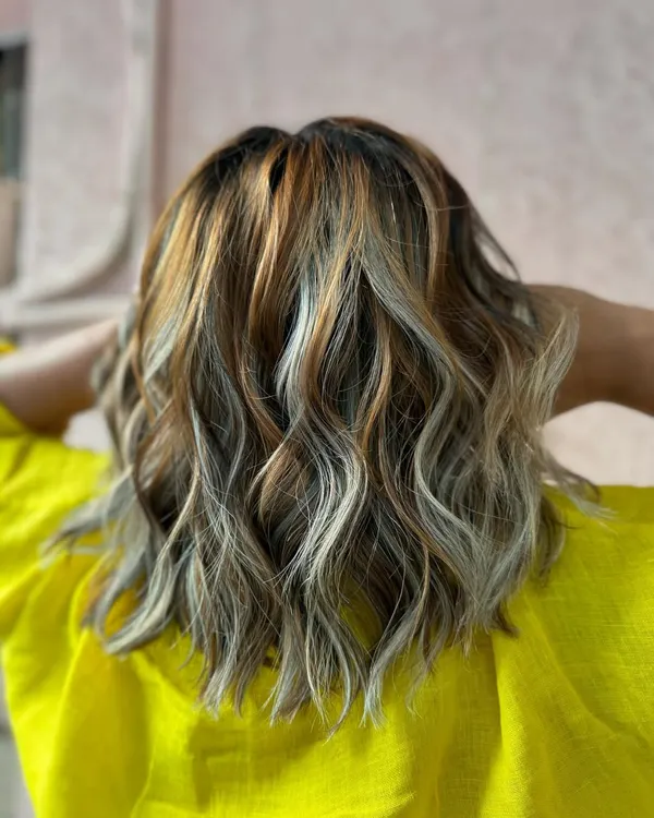 Extra sass with this blonde burst. A mix of platinum and warmer tones for a high-contrast, dimensional look. (No filter)