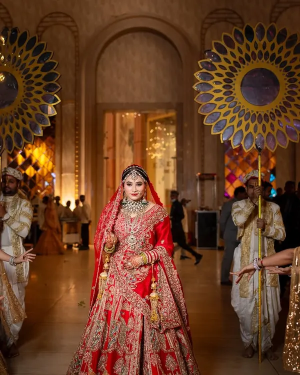 This is the moment every bride dreams of. I ensure your makeup is nothing short of regal, making your grand entrance unforgettable. This look features a classic red lehenga with flawless, long-lasting makeup designed to make you the center of everyone's world.