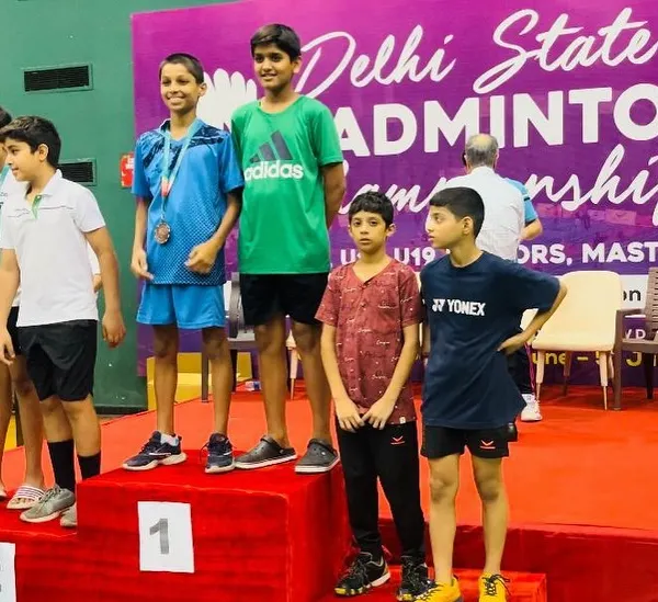 Our players on the podium at the Delhi State Ranking Badminton Tournament. This picture captures the success of Reyansh, Rajas, and Vatsal after their amazing performances in singles and doubles.