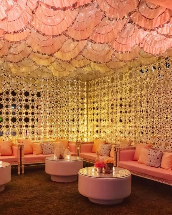 I transform spaces into breathtaking experiences. This Sheesh Mahal inspired lounge, with its intricate mirror work and soft, warm lighting, creates an unforgettable, luxurious ambiance for any celebration.