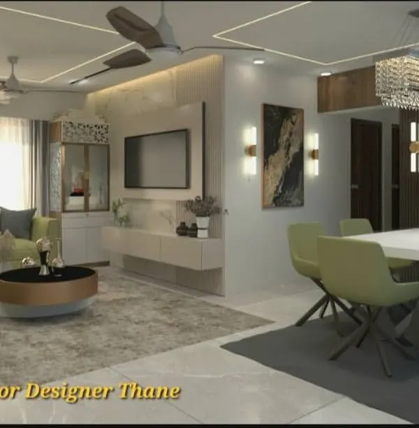 A wide view of a contemporary living and dining area, showcasing a cohesive design language. We integrated a floating TV console, a comfortable L-shaped sofa, and a six-seater dining set, all tied together with a neutral color palette and warm lighting.