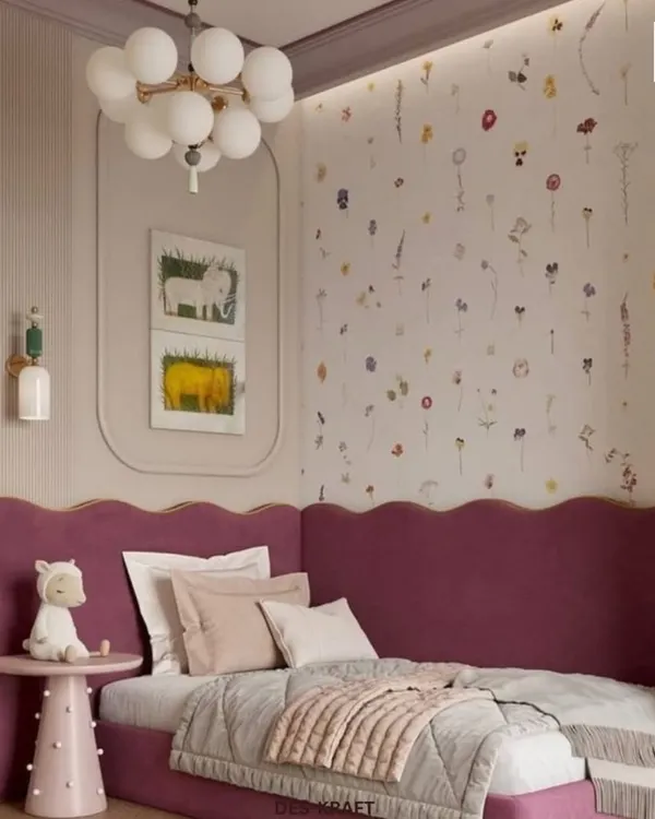 A dreamy child's room featuring a scalloped magenta headboard and whimsical floral wallpaper, creating a space that is both playful and chic.