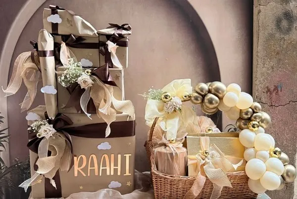 This is the kind of welcome every baby deserves. Our bespoke hamper for baby Raahi features a tower of beautifully wrapped gifts and a matching balloon basket, all in a sophisticated neutral color palette. We focus on creating an elegant, cohesive look that feels both luxurious and full of heart.