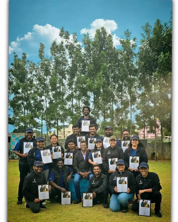 Our team of K9 coaches proudly holding our training certifications. We are committed to professional development and staying updated on the best dog behavior modification and training techniques.