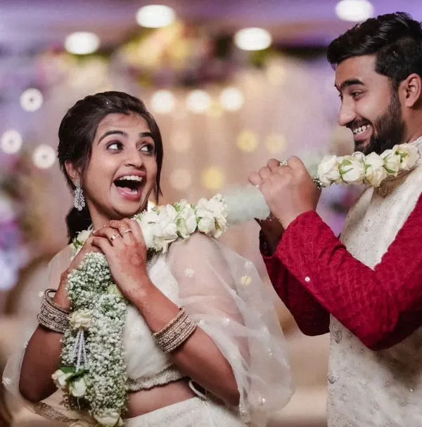 This is the kind of moment I live to capture. The pure, unscripted joy between a couple is the heart of any wedding story. This playful garland exchange shows their personalities and the fun of starting a life together.