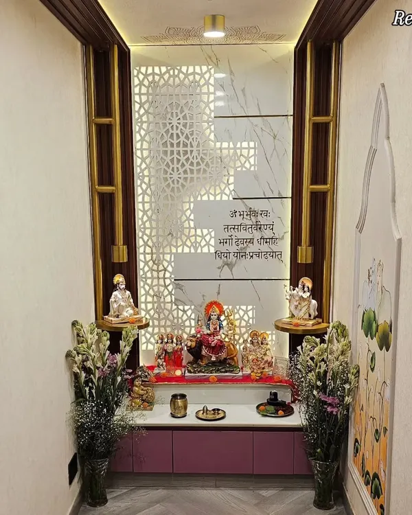 The final, real-life version of this beautiful mandir, complete with fresh flowers. The back-lit CNC cut panel and Gayatri Mantra inscription create a divine ambiance.