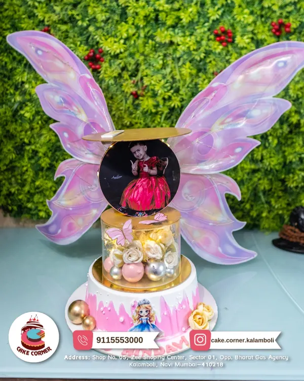 A truly magical, multi-tier fairy cake with a custom photo and light-up butterfly wings. This is a showstopper for any little girl's dream birthday party.