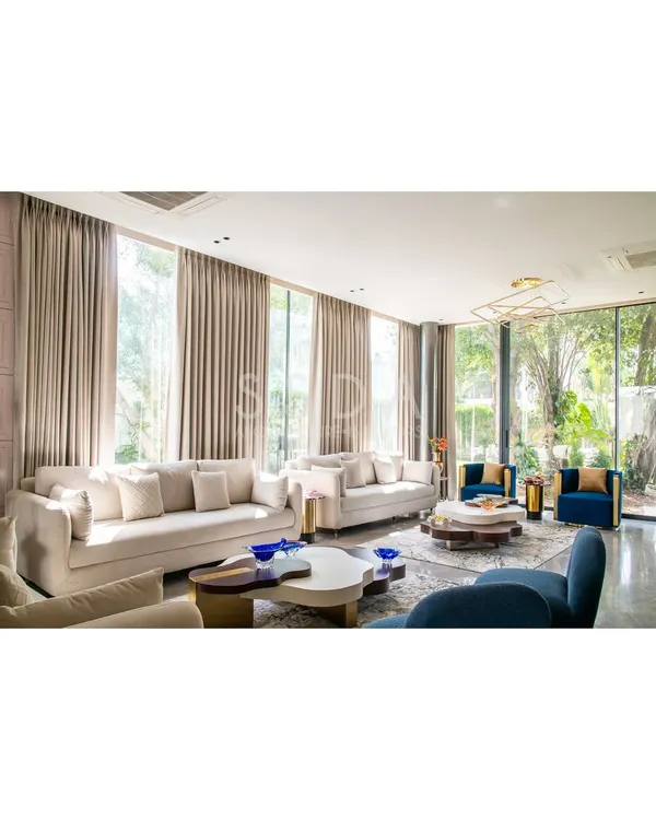 This living room, part of a reimagined villa, captures the essence of my design philosophy. By opening the space to the garden with floor-to-ceiling glass, I created a calm, light-filled sanctuary where contemporary luxury and nature coexist.
