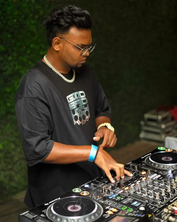 A close-up shot while I'm cueing up the next track. I'm constantly reading the crowd and adjusting my set, mixing in everything from R&B to commercial hits to keep the vibe just right.