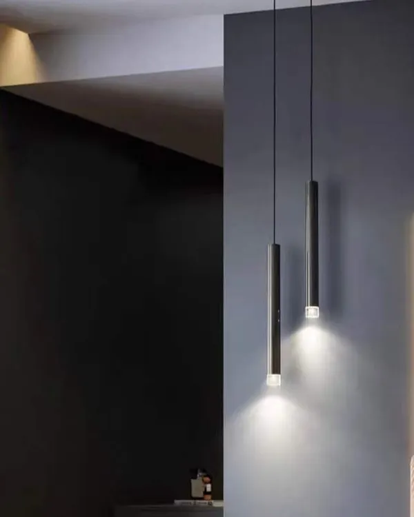 A pair of minimalist pendant lights, perfect for hanging over a bedside table or in a cozy reading corner.