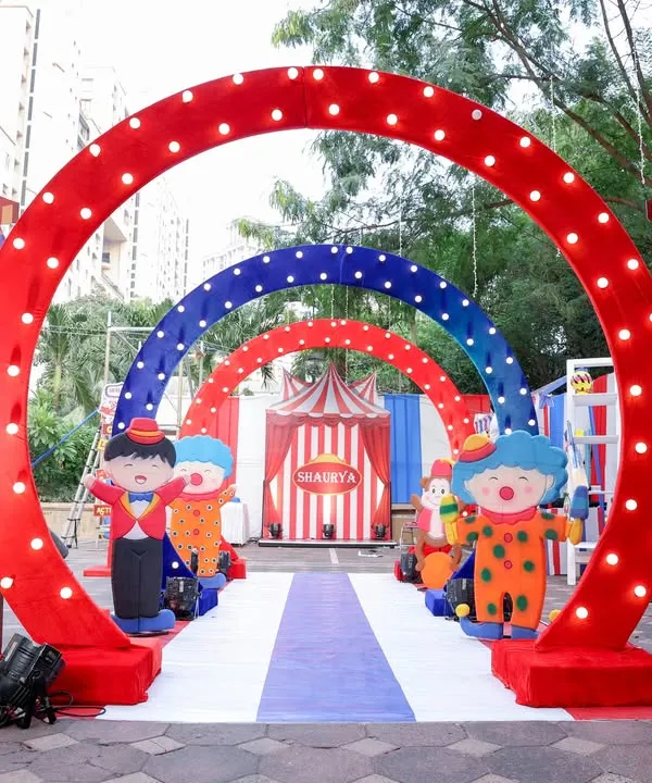 Step right up! This multi-arched carnival entrance with bright lights and character cutouts immediately set the tone for a fun-filled 10th birthday party. First impressions are everything!