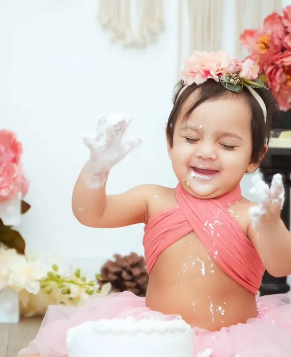 The pure joy of a first birthday cake smash. This little one is having the best time, and we're here to capture every messy, happy moment.