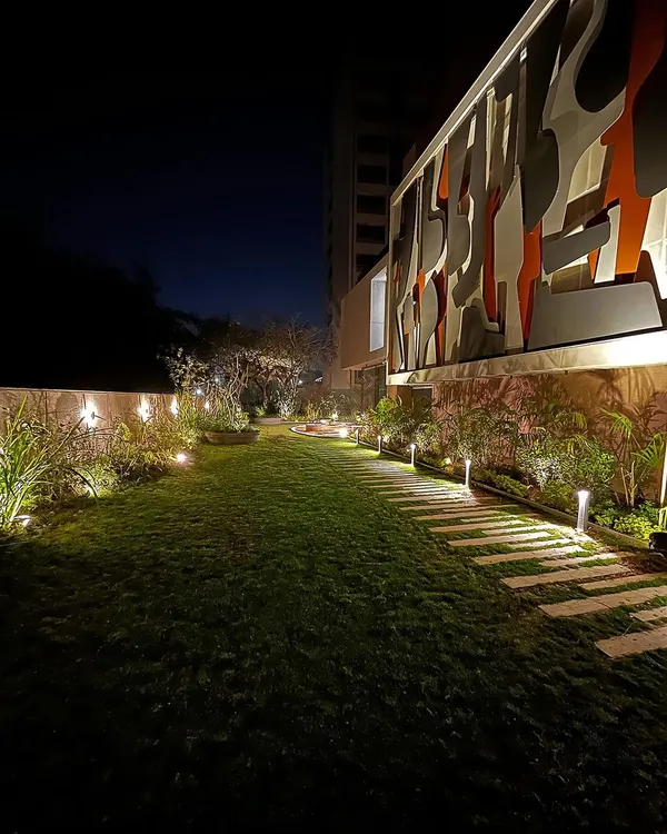 For the "FRAMED AUSTERITY" project, we used subtle uplighting on plants and a gentle wash of light on the pathway to guide movement and create a serene mood.