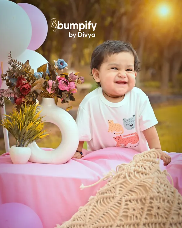The purest joy. This close-up captures a radiant, genuine smile during an outdoor picnic shoot, with the warm sunlight making the moment glow.