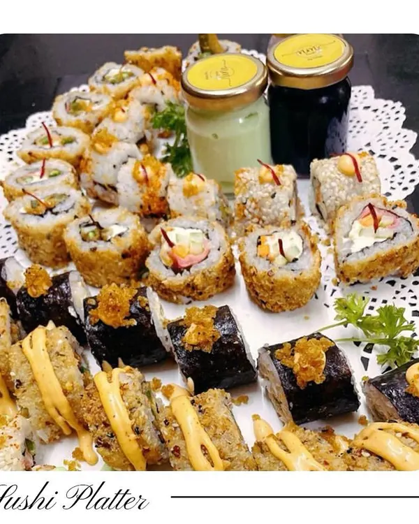 My vegetarian Sushi Platter is a feast of textures and flavours. It includes a variety of rolls like Veg Tempura, Asparagus, and Avocado, served with wasabi and soy sauce for the complete experience.