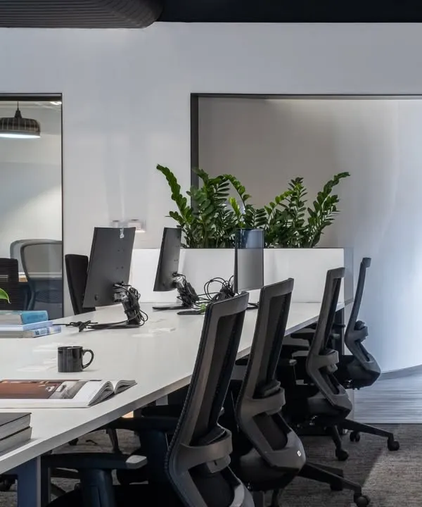 An open-plan office designed for collaboration and energy. I use long, shared desks and integrated planters to create a dynamic environment that encourages interaction while maintaining a clean aesthetic.