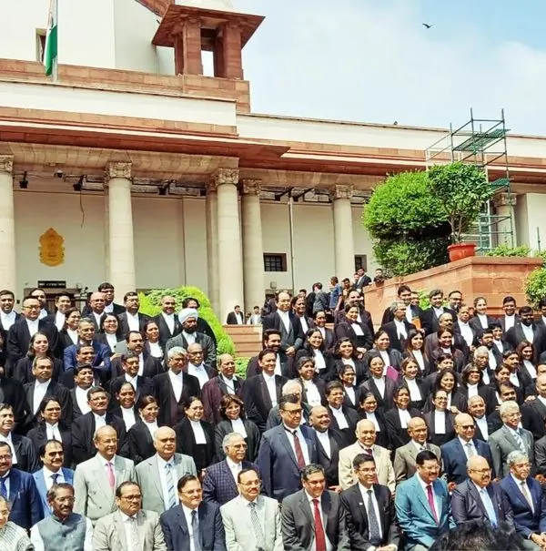 A group photograph at the Supreme Court. It was an honor to sit on a bench for the day to contribute to the court's efforts to settle cases and speed up the justice system where possible.