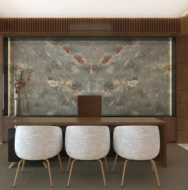 The main desk area in the Chairman's office for AMC Group, where a stunning book-matched marble feature wall creates a powerful backdrop. The design combines natural materials with clean lines for a look of modern authority.