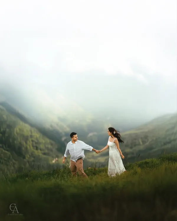 I believe your love story deserves a backdrop as grand as your feelings. Here, we ventured into the hills to capture this moment of the couple walking hand in hand, with misty mountains unfolding behind them, creating a truly epic pre-wedding portrait.