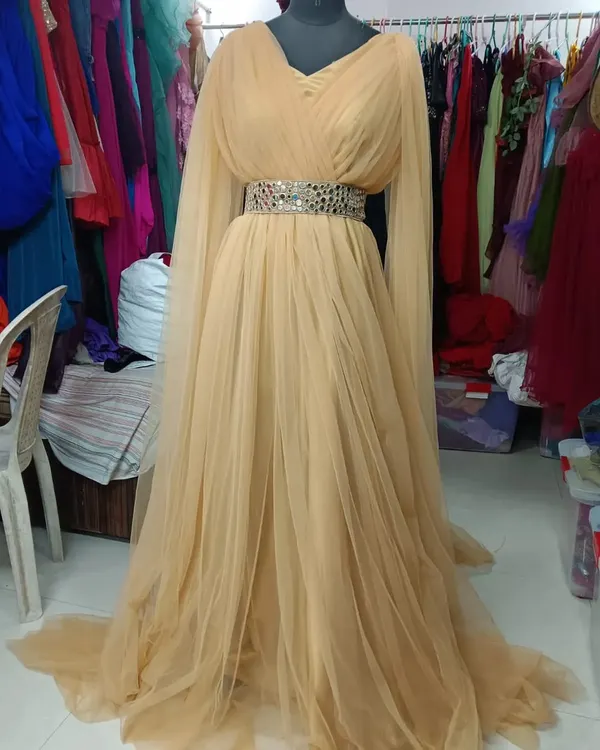 This is my Golden Angel wings gown, perfect for a pre-wedding or maternity shoot. The long, flowing sleeves create a beautiful wing-like effect.