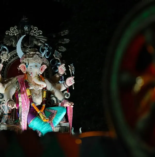 This is an award-winning shot from the Sanpadya Cha Maharaja Aagman Sohala in Navi Mumbai. I used a telephoto lens to isolate the magnificent idol against the night sky, creating a sense of grandeur and devotion that defines the Ganesh Chaturthi festival.