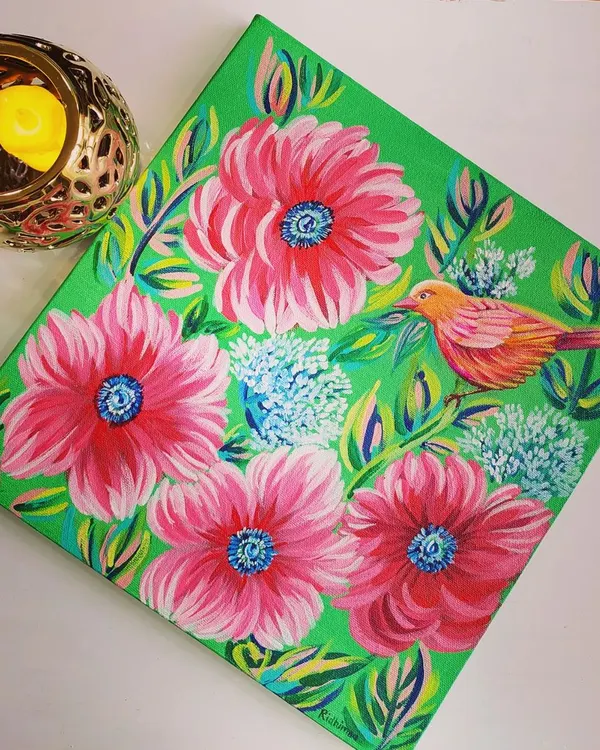 A finished acrylic painting on canvas, featuring a colorful bird amidst vibrant pink flowers. This piece showcases the lively and detailed style I teach in my canvas painting classes for adults and teens.