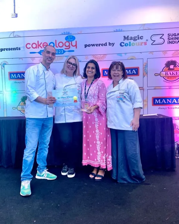 Receiving the first-place award for my sculpted cake at Cakeology. I am so grateful for these moments that celebrate the art of cake decorating.