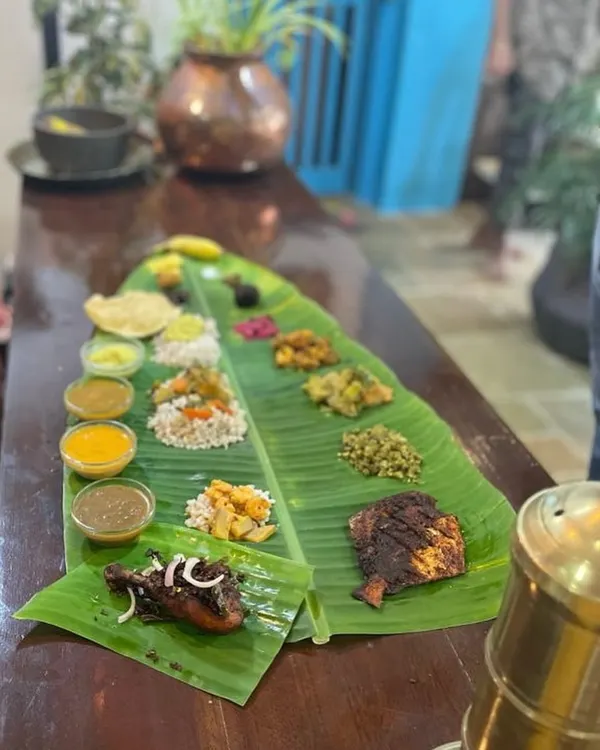A feast for the eyes and soul. This is my UnSadya, a lavish spread served on a traditional banana leaf, featuring both vegetarian classics and our signature non-veg dishes like fried fish and chicken roast. It’s a true celebration of Kerala’s abundant flavors, with no rules, just pure taste.