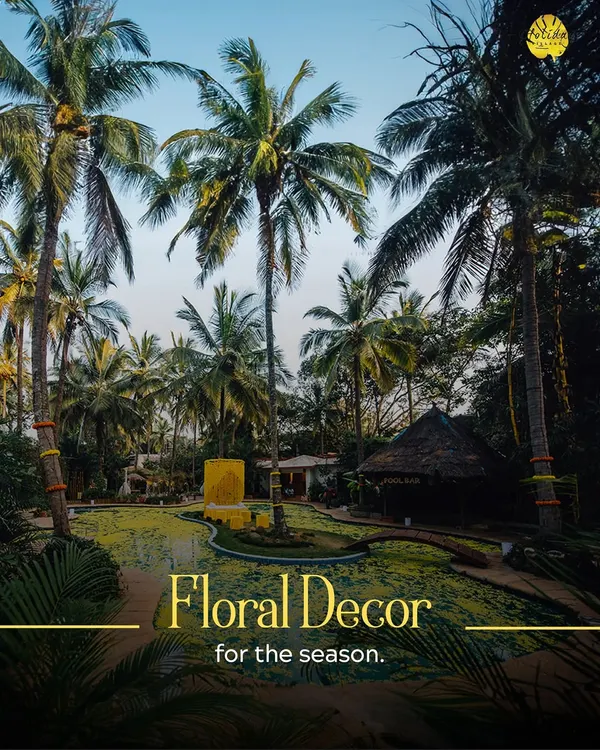 Our poolside area transformed with floral decor for a festive event. The vibrant yellow flowers floating on the water create a stunning visual for a daytime celebration like a Haldi ceremony.