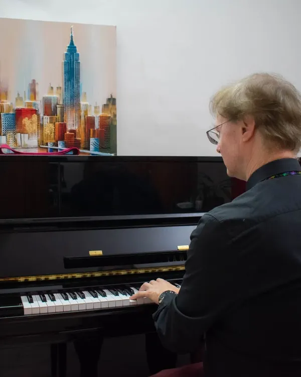 Mr. Richard Lewis, an esteemed examiner from ABRSM, playing the piano during an examination session held at our BEML branch.
