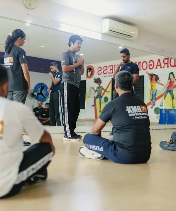 Our head instructor, Rhys Vaz, explains a core principle during a Third Party Protection seminar in Mangalore. We emphasize understanding the 'why' behind every technique.