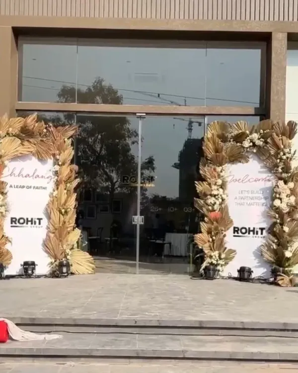 The grand entrance for a real estate project inauguration, featuring elegant boho-style arches with dried florals that create a sophisticated and welcoming first impression.