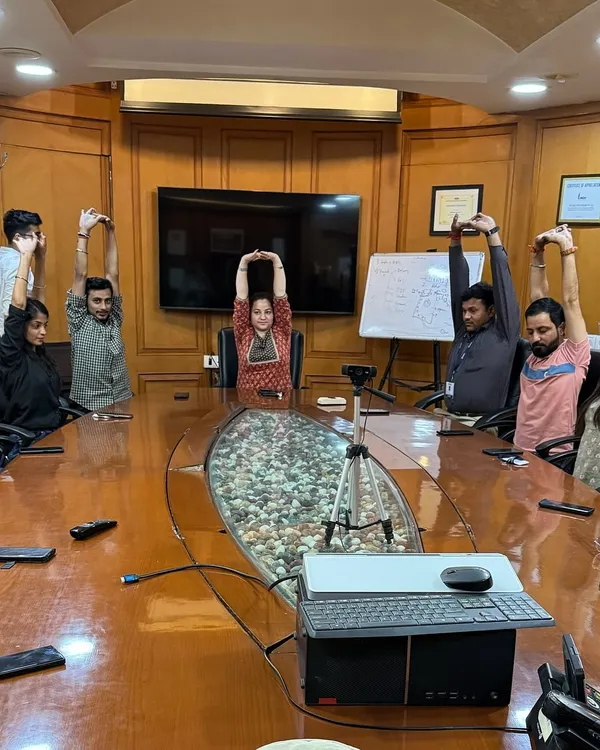 Bringing a moment of calm to the corporate world. This is a session with the team at SMC Global, where we practiced simple stretches and breathing exercises right in the conference room to relieve desk-related stress.