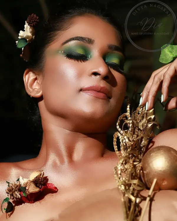 A close-up of my nature-inspired creative makeup. You can see the detailed blending of green eyeshadows and the delicate placement of floral elements to create a cohesive, artistic look.