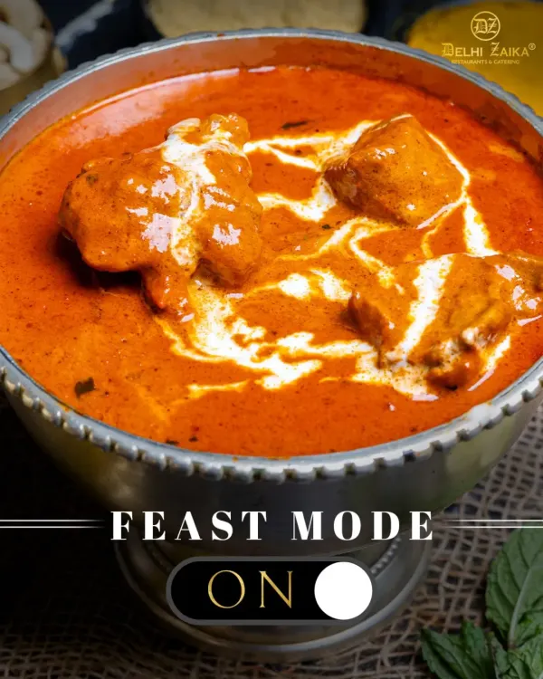 Feast Mode: ON. This is our iconic Butter Chicken, with tender chicken pieces swimming in a velvety, orange-hued tomato and cream gravy. It's the ultimate comfort food.