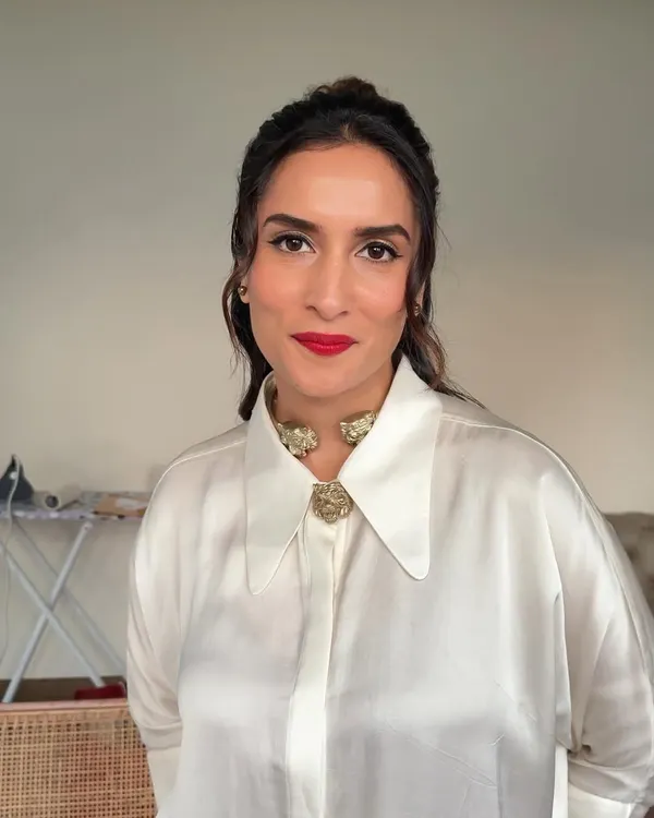A classic glam look featuring a sharp winged liner and a bold red lip. This timeless combination is perfect for a cocktail party or reception, exuding confidence and sophistication.