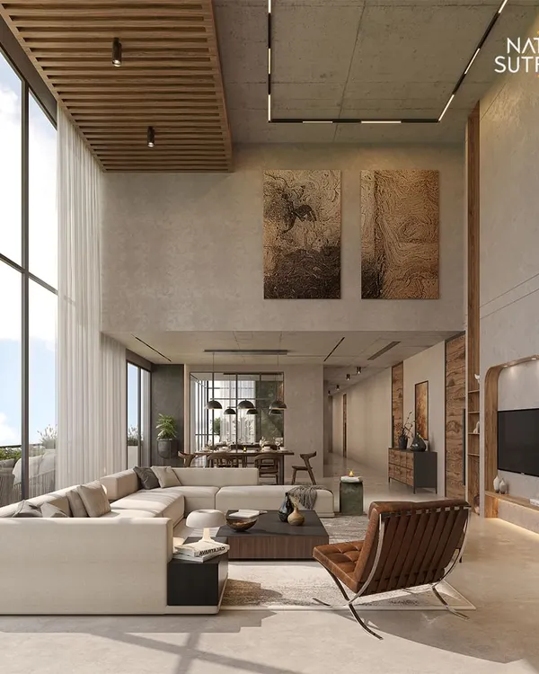 We believe a home should be a grand statement of personal style. This double-height living area, designed with Brutalist principles, uses raw concrete, natural light, and expansive volume to create a space that is both monumental and intimately welcoming. It embodies our philosophy of crafting homes that are not just seen, but experienced.