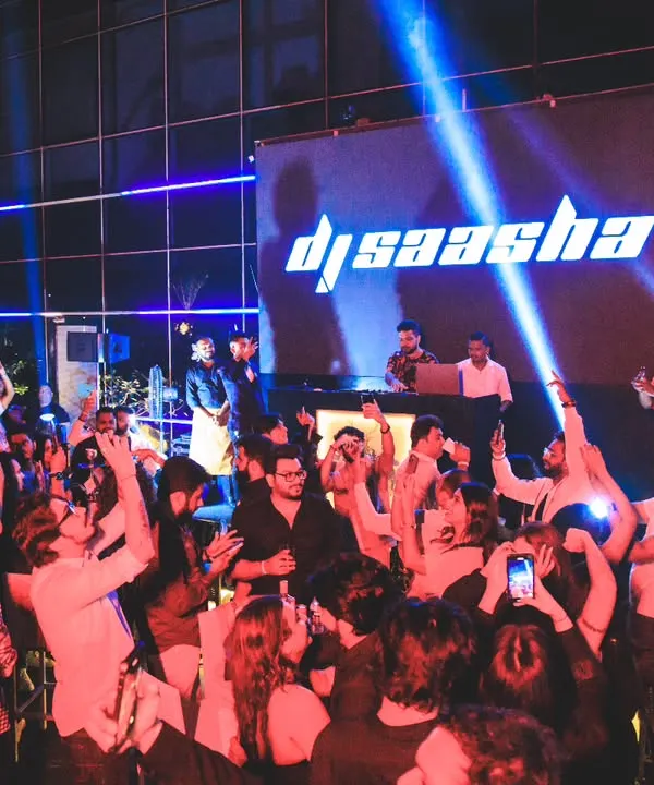 This is the moment I live for. Seeing a sea of hands in the air at a packed rooftop venue, with my name on the big screen, is a feeling like no other. This is the energy I bring to every DJ set.