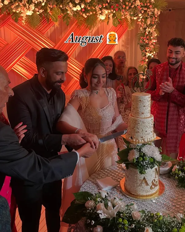 It was an honor to create this stunning tiered wedding cake for this beautiful couple's big day. Adorned with fresh flowers and a custom monogram, it was the perfect centerpiece.