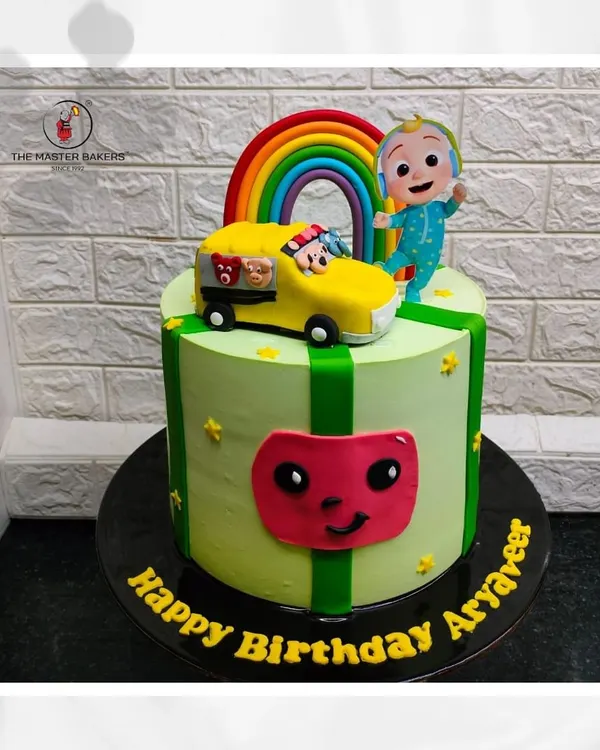 Here is a vibrant Cocomelon cake I made for Aryaveer's birthday. It features the iconic watermelon, a bright rainbow, and JJ on his school bus, bringing the fun of the show to the celebration.