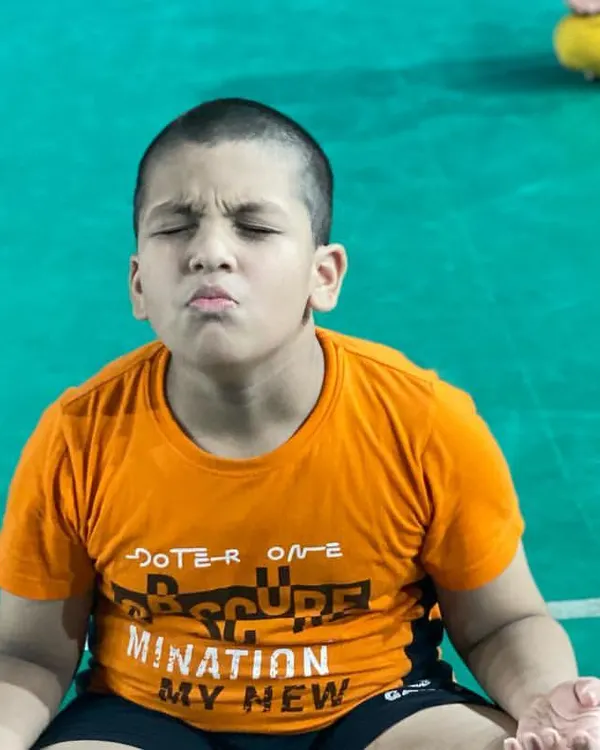 This is the look of pure focus. I teach my students meditation techniques to help them stay calm and centered during intense competition. A strong mind is a player's greatest asset.